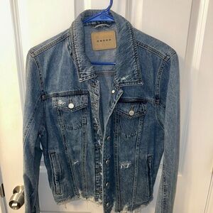 Distressed blue jean jacket